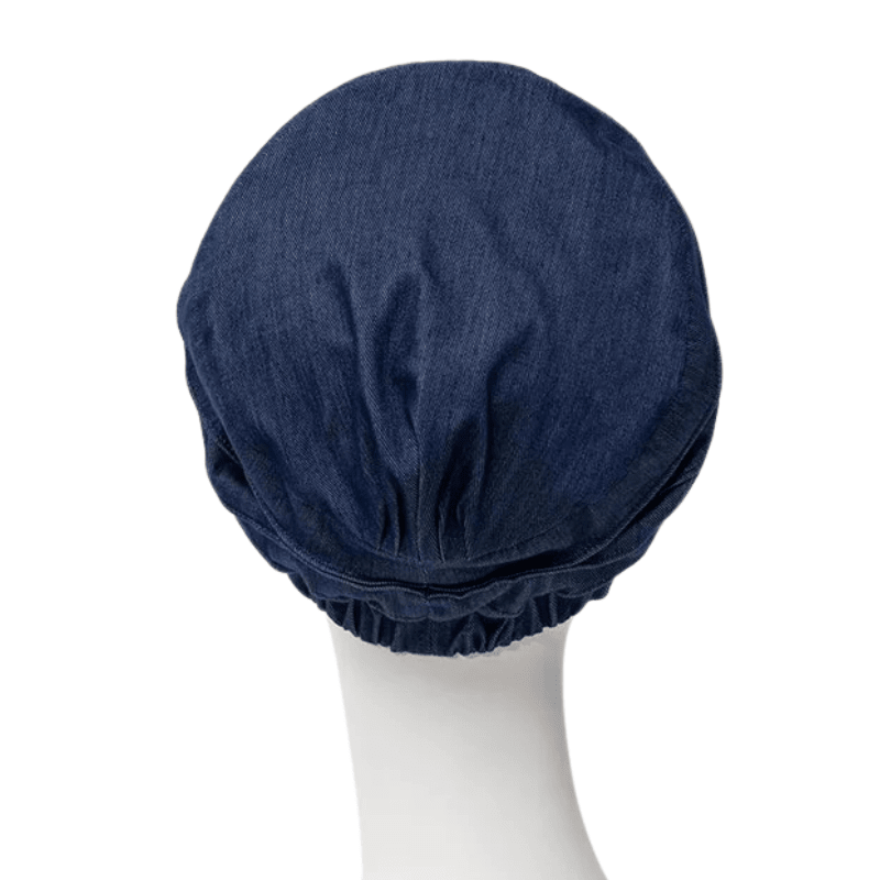 Back of dark blue Christine Headwear Yoga turban in denim fabric on mannequin, with gathered edge