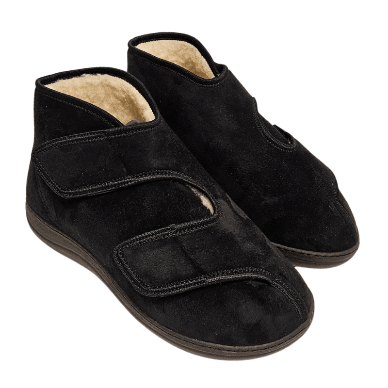 A pair of black therapy shoes with velcro straps and a glimpse of the light wool lining inside
