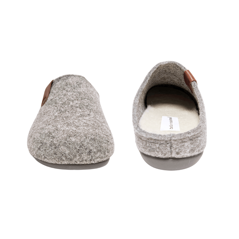 Two grey Bella Moda wool slippers seen from front and back, showing the soft interior