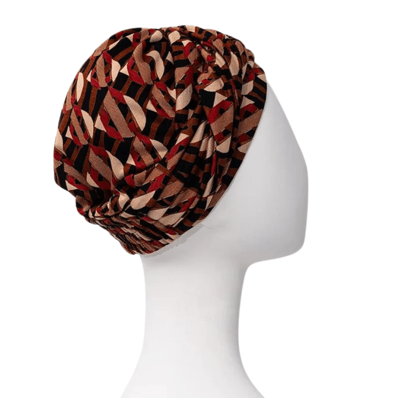 Sapphire Boho turban with Tribal Art pattern, shown from the right side on a white mannequin