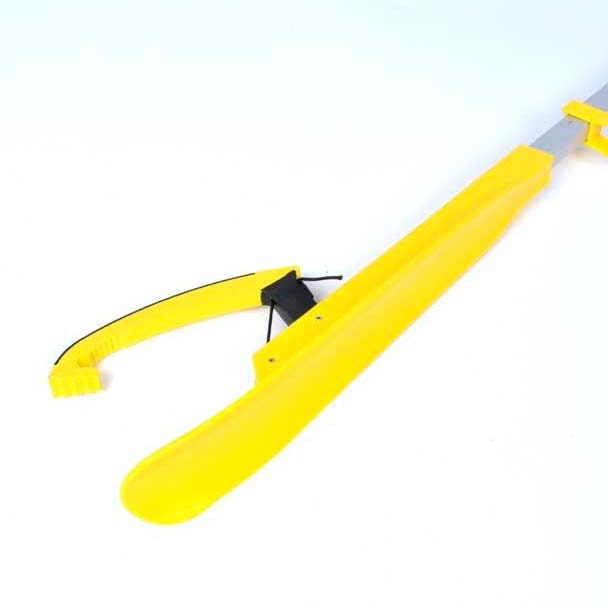 Close-up of the yellow grabber's head with the black rubber-coated claw and the integrated shoehorn