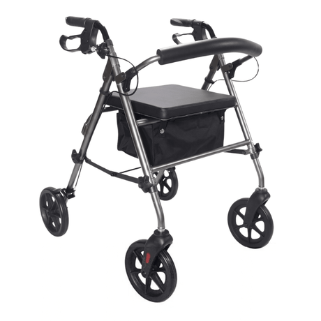 Grå Ibis rollator set skråt forfra med polstret sæde, rygbøjle og sort tekstilkurv