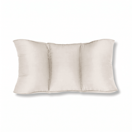 Light beige lumbar pillow with natural fibers, divided into three chambers, seen from the front on a white background