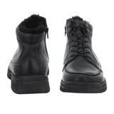 Two black Waldläufer men's boots, one seen from the front with laces, the other from the back with warm lining
